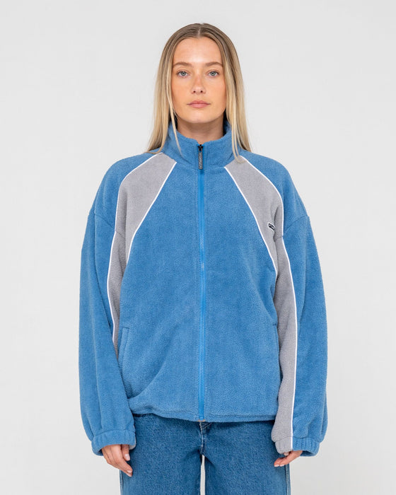 woman-wearing-two-tides-zip-through-sherpa-fleece-in-blue-grey