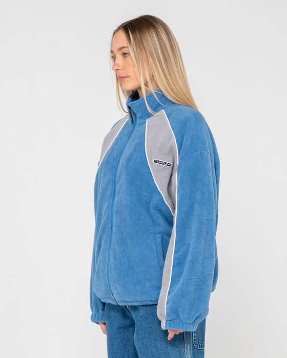 woman-wearing-two-tides-zip-through-sherpa-fleece-in-blue-grey