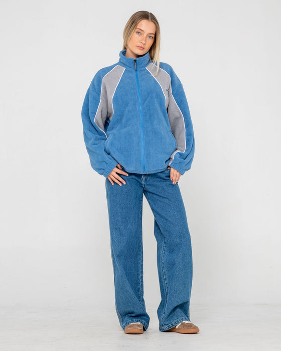 woman-wearing-two-tides-zip-through-sherpa-fleece-in-blue-grey