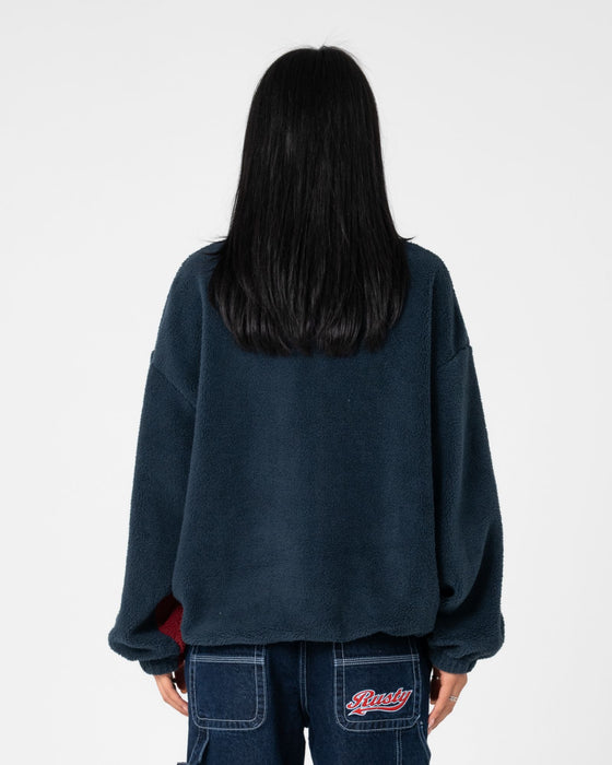 woman-wearing-two-tides-zip-through-sherpa-fleece-in-navy-red