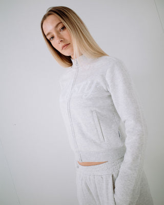 Woman wearing Trailer Trash Skimmer Zip Through Fleece in Ecru Marle