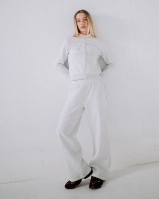 Woman wearing Trailer Trash Skimmer Zip Through Fleece in Ecru Marle