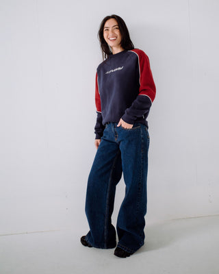 Woman wearing South Of The River Oversize Crew Fleece in Navy / Red