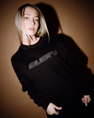 Woman wearing R Essential Oversized Crew Fleece in Black