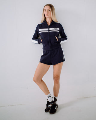 Woman wearing Retro Lines Zip Through Hooded Fleece in Navy Blue