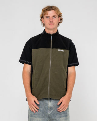 Man wearing On The Run Tech Fleece Vest in Army Green