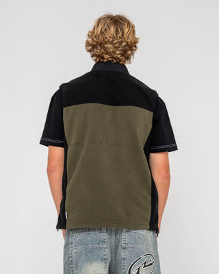 Man wearing On The Run Tech Fleece Vest in Army Green