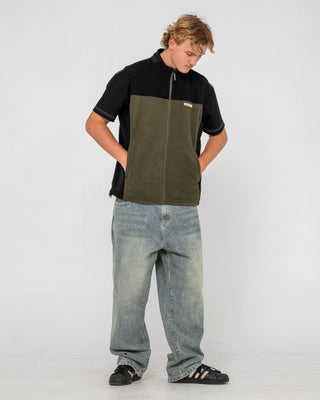 Man wearing On The Run Tech Fleece Vest in Army Green