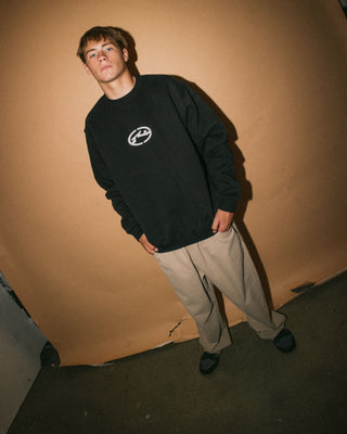 Man wearing Turbo Crew Fleece in Black