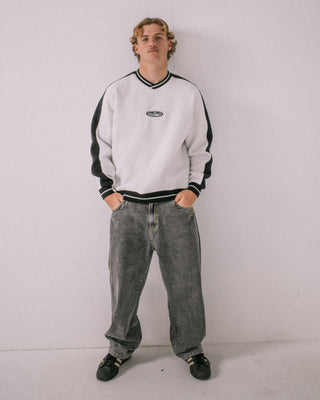 Man wearing Vengeance V Neck Fleece in Ecru Marle