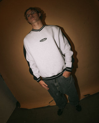 Man wearing Vengeance V Neck Fleece in Ecru Marle