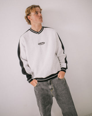 Man wearing Vengeance V Neck Fleece in Ecru Marle