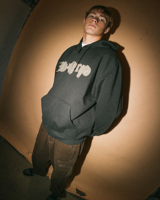 Man wearing Ransom 2.0 Zip Thru Hooded Fleece in Carbon