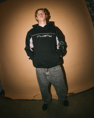 Man wearing Titan Hooded Fleece in Black