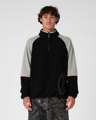 Man wearing Tectonic Quarter Zip Polar Fleece in Black