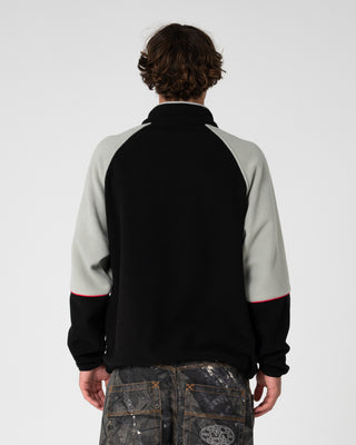 Man wearing Tectonic Quarter Zip Polar Fleece in Black