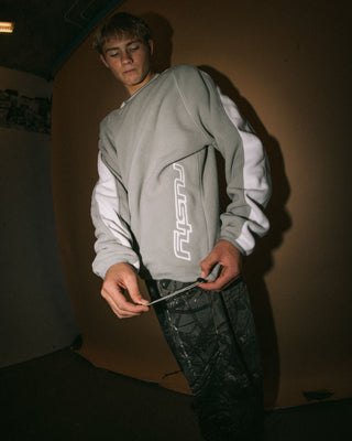 Man wearing Triggerman Crew Neck Polar Fleece in Stone Grey