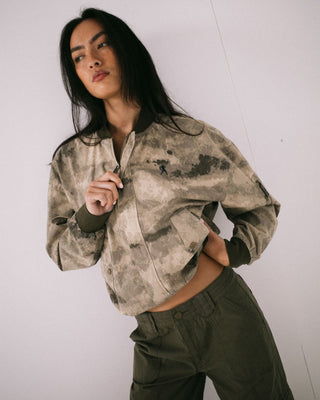 Woman wearing Fly Away Bomber Jacket in Camo