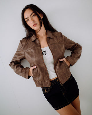 Woman wearing Lizzy Faux Leather Fitted Jacket in Ash Brown