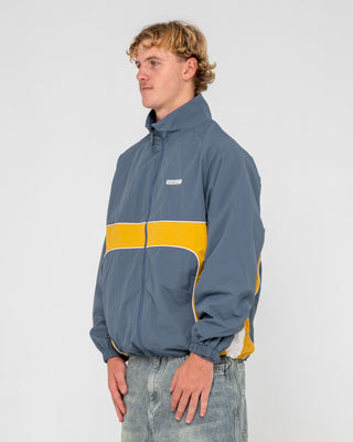 Man wearing Hocus Pocus Zip Thru Jacket in Steel Blue
