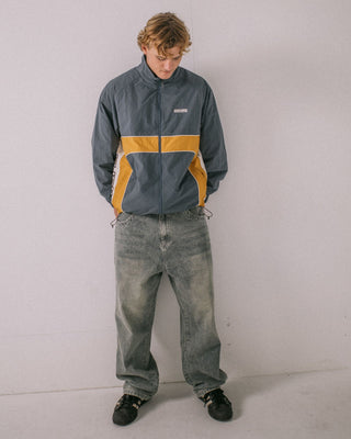 Man wearing Hocus Pocus Zip Thru Jacket in Steel Blue