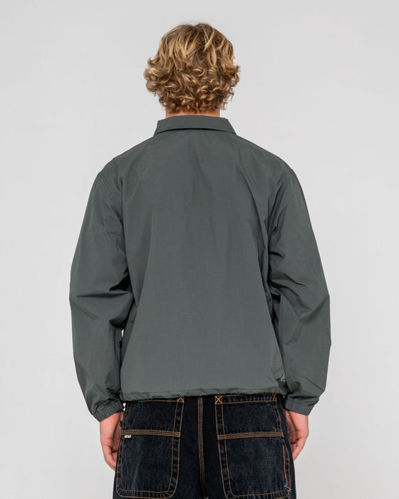 man-wearing-pirahna-shell-jacket-in-slate