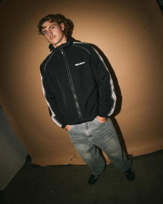 Man wearing Lock Out Hooded Jacket in Black