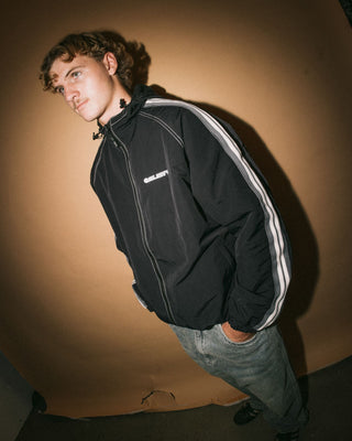 Man wearing Lock Out Hooded Jacket in Black