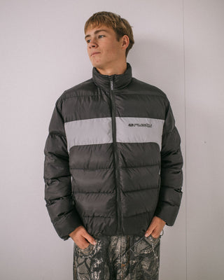 Man wearing Pit Viper Puffer Jacket in Black