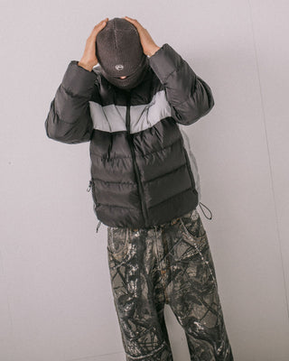 Man wearing Pit Viper Puffer Jacket in Black