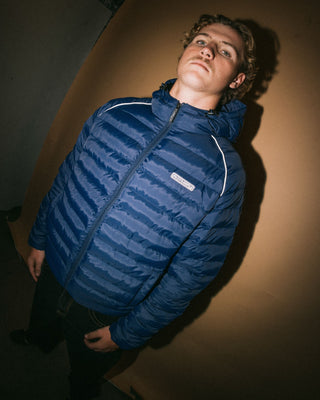 Man wearing Pipe Line Puffer Jacket in Navy Blue