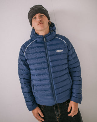 Man wearing Pipe Line Puffer Jacket in Navy Blue