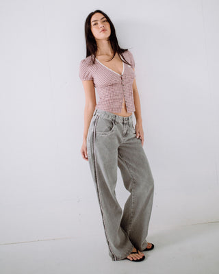 Woman wearing Flip Mommy Low Rise Wide Leg Denim Jean in London Summer / Baby Pink