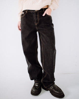 Woman wearing Bethany Baggy Low Rise Jean in Black Out