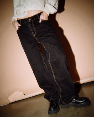 Woman wearing Bethany Baggy Low Rise Jean in Black Out