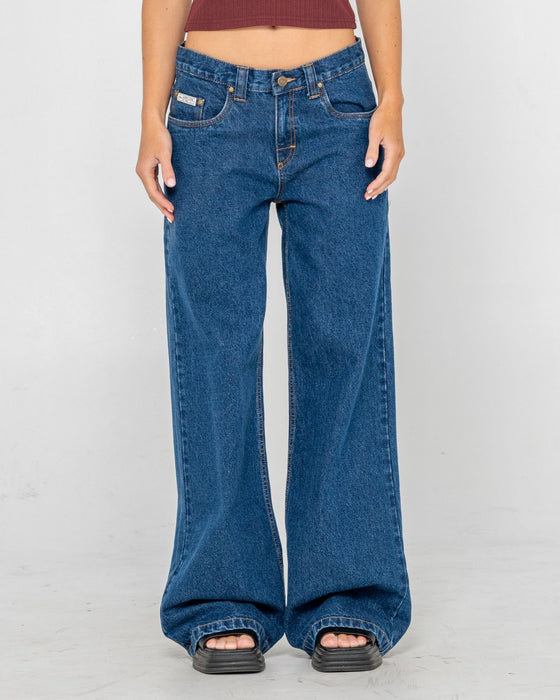 woman-wearing-wendy-wide-low-rise-denim-jean-in-deep-sea-blue