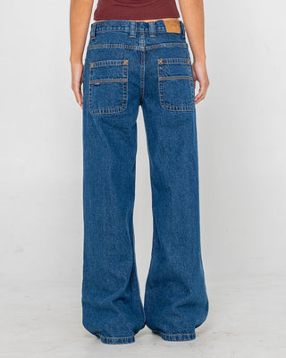 Woman wearing Wendy Wide Low Rise Denim Jean in Deep Sea Blue