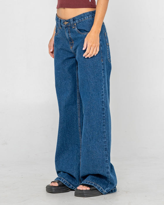 woman-wearing-wendy-wide-low-rise-denim-jean-in-deep-sea-blue