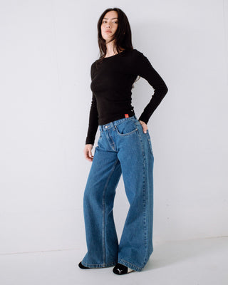 Woman wearing Wendy Wide Low Rise Denim Jean in Middy Blue