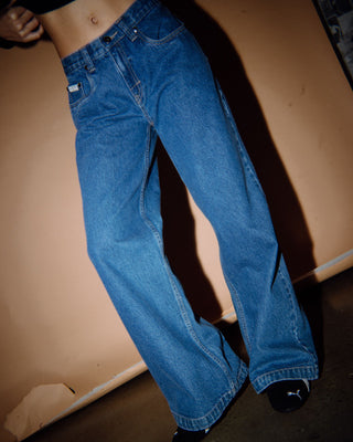 Woman wearing Wendy Wide Low Rise Denim Jean in Middy Blue