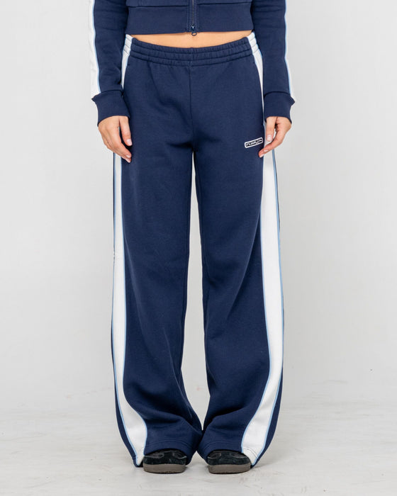 woman-wearing-retro-lines-wide-leg-track-pant-in-navy-blue