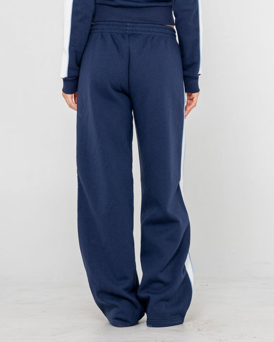 woman-wearing-retro-lines-wide-leg-track-pant-in-navy-blue