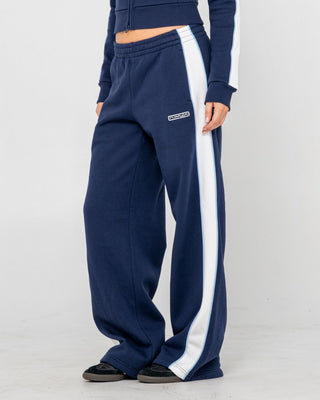 Woman wearing Retro Lines Wide Leg Track Pant in Navy Blue