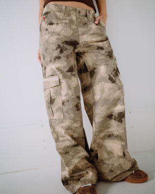 Woman wearing Camoozy Low Rise Cargo Pant in Camo