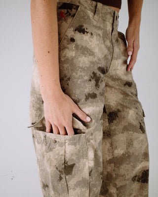 Woman wearing Camoozy Low Rise Cargo Pant in Camo