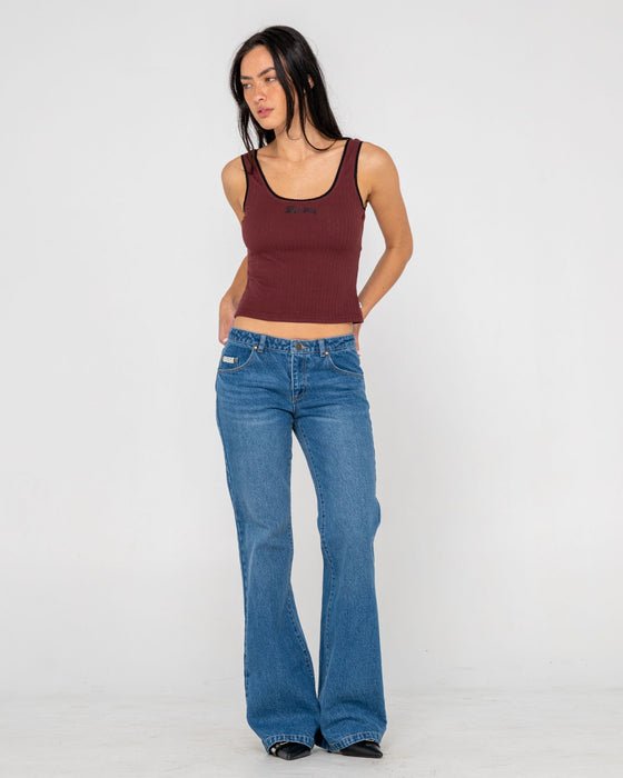 woman-wearing-freida-flare-low-rise-jeans-in-blasted-middy-blue
