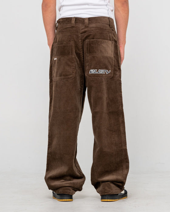 man-wearing-flip-daddy-cord-pant-in-dark-choc