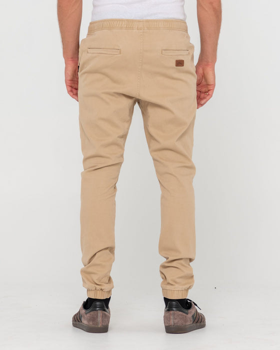 man-wearing-hook-out-elastic-pant-in-khaki