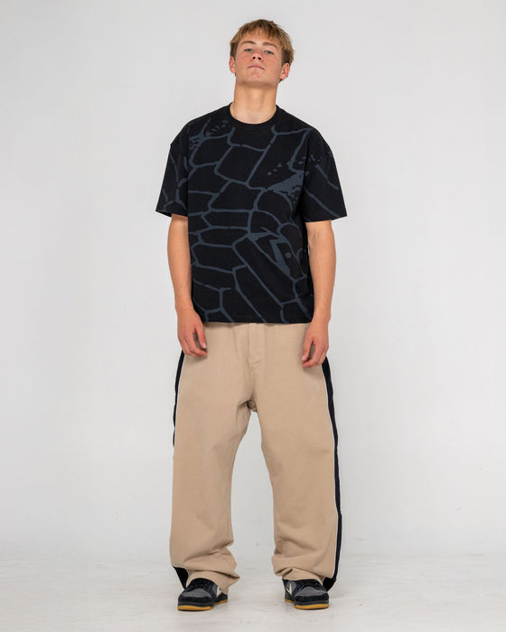 man-wearing-flip-daddy-taped-pant-in-abbey-stone