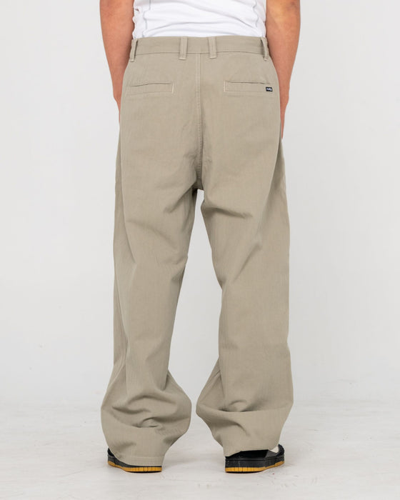 man-wearing-request-line-herringbone-pant-in-abbey-stone